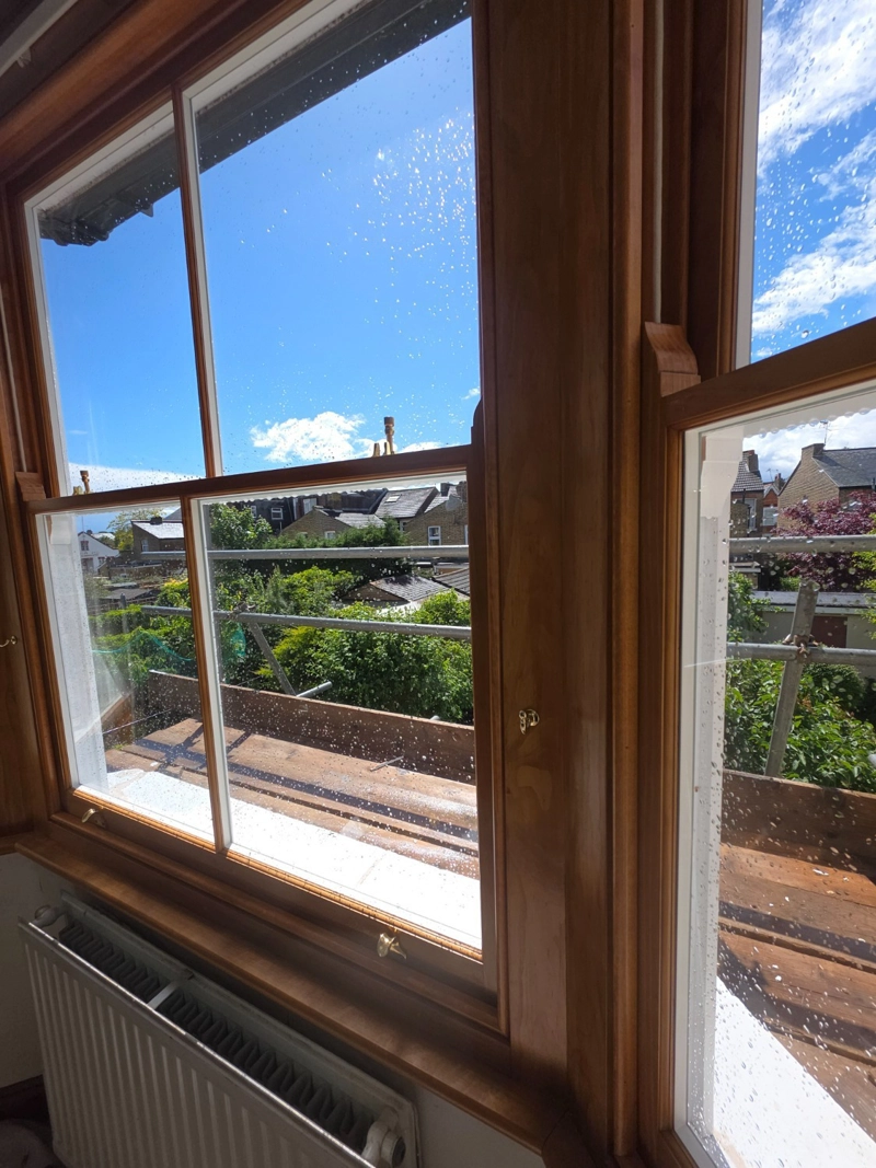 Accoya timber double glazed sash windows with a natural internal stained finish