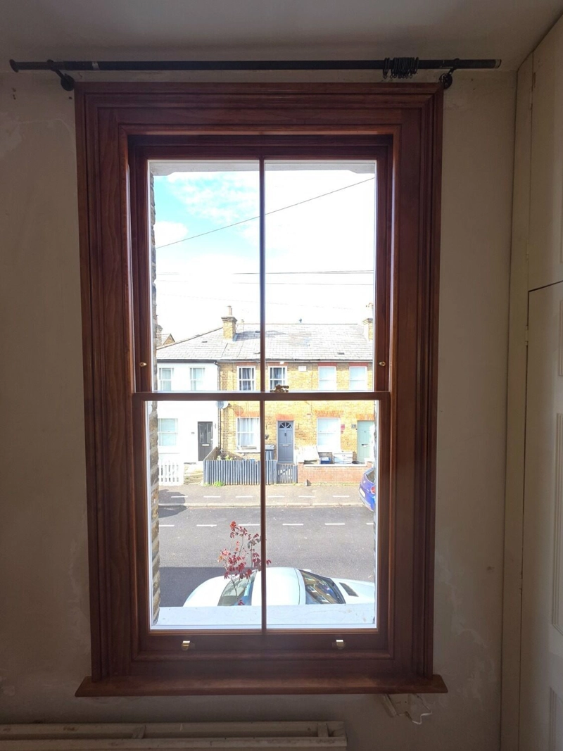 Stained timber sash window
